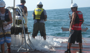 The multicore and men working on deck to bring up a little of the ocean floor 