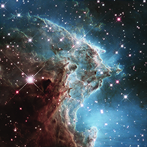 Monkey Head (NGC 2174): image of the nebula taken by the Hubble telescope, containing young stars (bright spots), plasma clouds and molecular clouds (dark regions) (Click for more details)