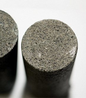 Samples of concrete containing particles obtained from discarded, shredded tires
